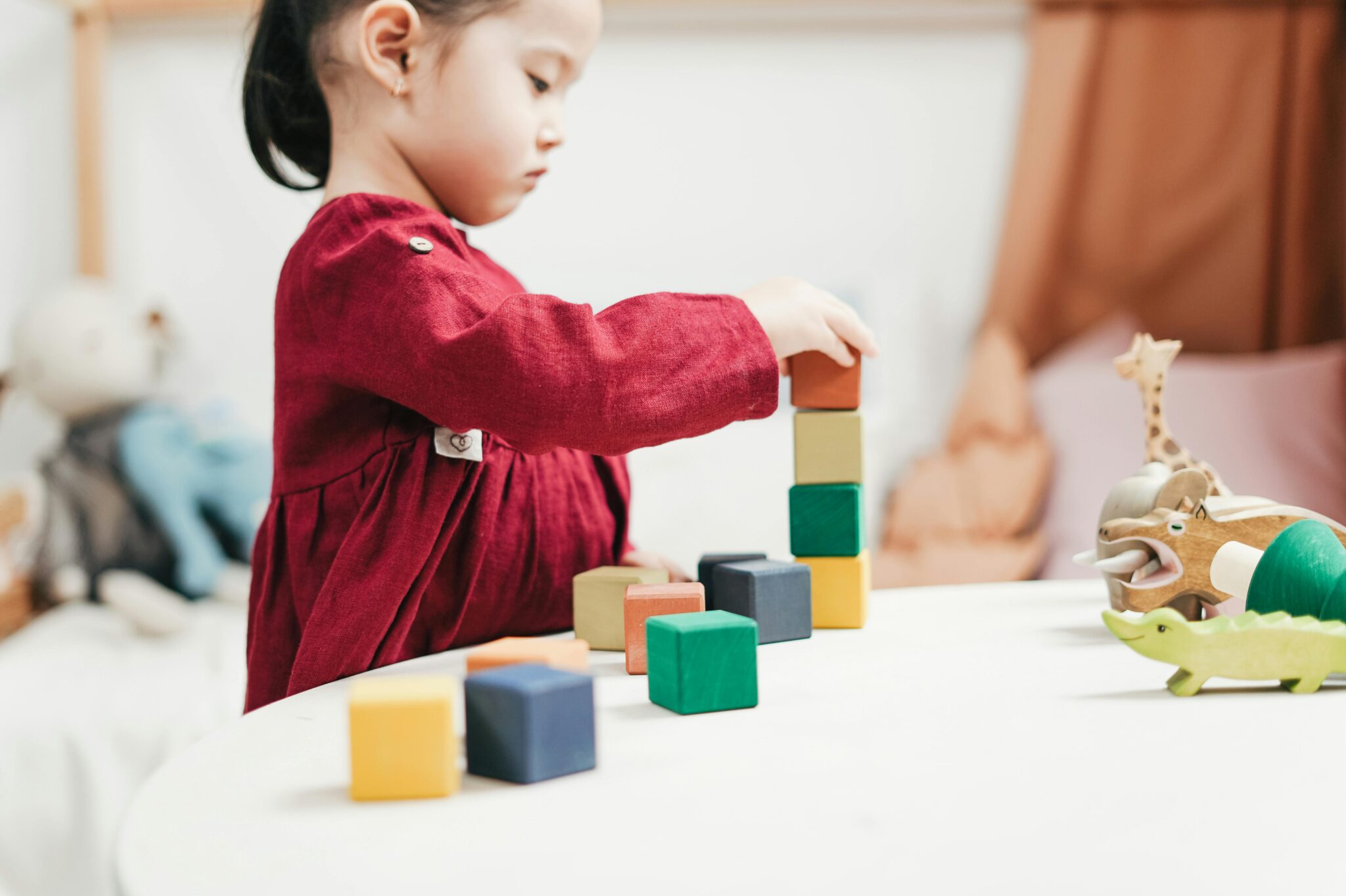 A girl using colorful blocks to learn math concept and activity